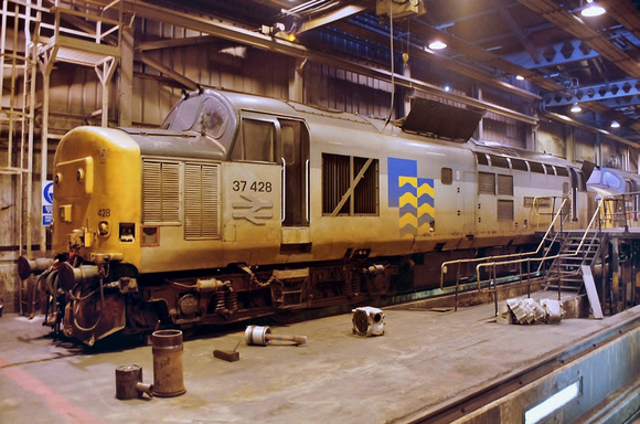 37428 "David Lloyd George" in Trainload Petroleum livery seen inside Eastfields Depot undergoing maintenance.