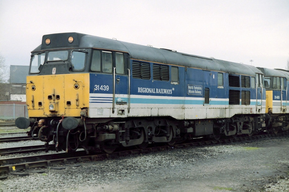 31439 in Regional Railways livery at Warrington Arpley Sidings.