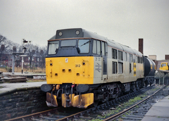 31312 in Trainload Coal livery and a TTA tank wagon for company at an unknown location.